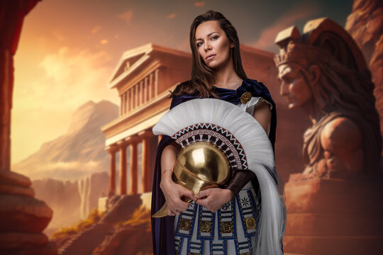 Shot of female greek general dressed in cloak and tunic against ancient building.
