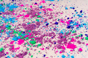 Top view of colorful traditional holi powder in bowls isolated on white background. Space for text. Concept Indian color festival called Holi.