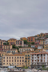 city view from the sea to the city of porto santo stefano