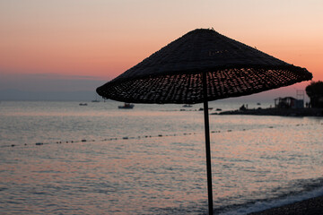 Vacation under straw umbrella on the beach