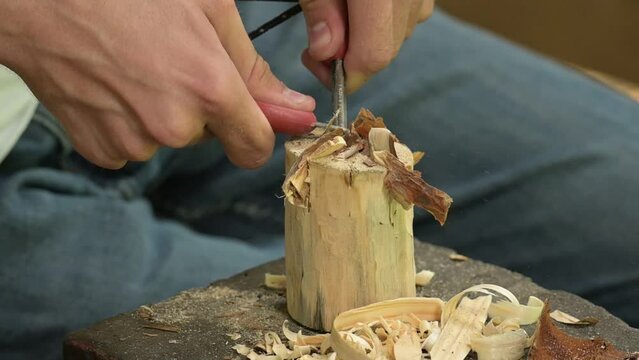 Using flint and steel to light a campfire