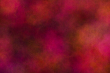 Beautiful of abstract colored dust explosion on black background.  It's red, green, blue, yellow, purple and orange powder is moving in frame. 