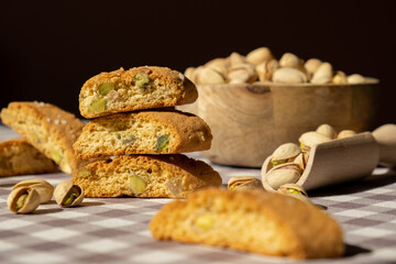 Biscotti Cantuccini Cookie Biscuits with pistachios and lemon peel Shortbread. Healthy eating food. Homemade fresh Italian cookies cantucci stacks and organic pistachios nuts. Vegan dieting vegetarian