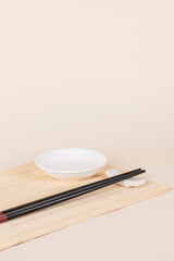 sushi set with bamboo placemat on beige background