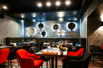 Interior of cozy modern restaurant in light, soothing colors with an original design