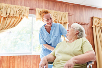 Nurse cares for elderly woman in wheelchair