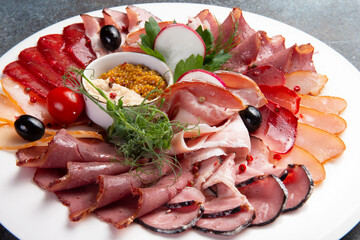 Sliced meat delicacies in a plate.