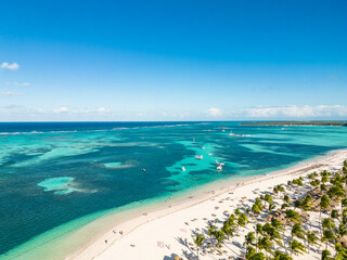 Aerial view of the white sand tropical shore and turquoise water of the Caribbean Sea. Bavaro beach, Punta Cana Dominican Republic