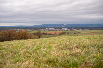 Cityscape of Schaafheim, with agricultural fields in the front and Mountain range in the background...