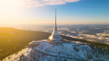Foto op Canvas Jested mountain with modern hotel and TV transmitter on the top, Liberec, Czech Republic. Sunny winter day with snowy landscape. Aerial view from drone. © pyty