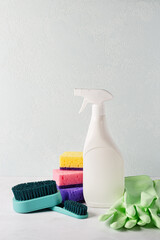 Set of cleaning equipment for cleaning various surfaces on light marble background. Concept of...