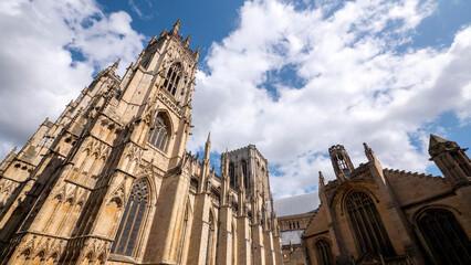 Fototapeta na wymiar Extreme wide angle looking up at York Minster in sunshine - Room for copy