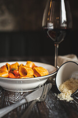 Appetizing Italian pasta on a dark wooden table. Food photography. Still life