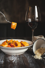 Appetizing Italian pasta on a dark wooden table. Food photography. Still life