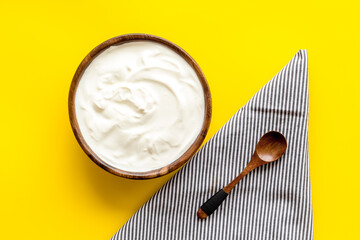 Bowl of sour cream or yogurt. Dairy product background