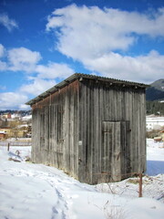 Old wooden barn in winter