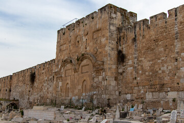 Fototapeta premium Golden Gate of the old city of Jerusalem. The Muslim cemetery of Bab Al-Rahma