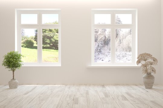 White empty interior concept in hight resolution with summer and winter landscape in window. 3D illustration