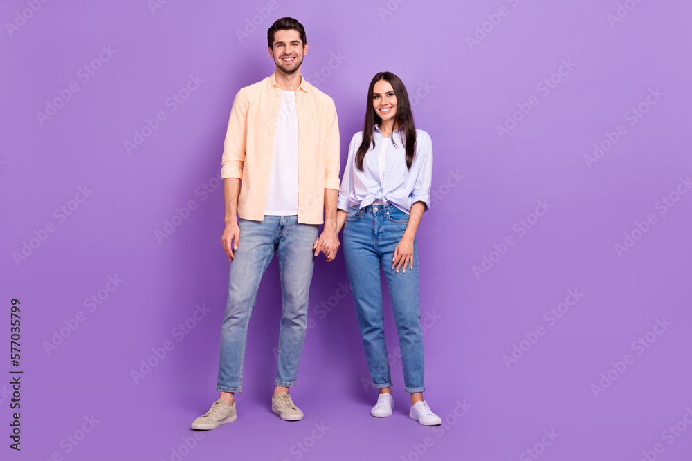 Aufkleber full size photo of two positive people hold hands toothy smile good mood isolated on violet color ba