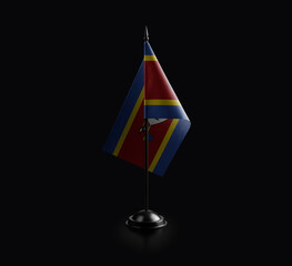 Small national flag of the Swaziland on a black background