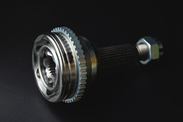 New CV joint on a black background. Constant velocity joint. New spare part