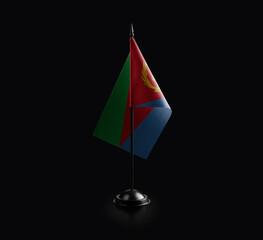 Small national flag of the Eritrea on a black background