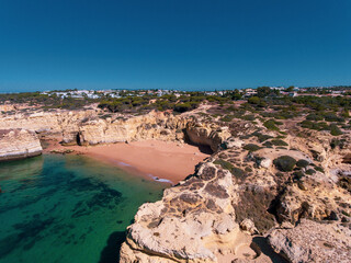 Aerial photos of Algarve Coast in Faro, Portugal capture the region's stunning beaches, rugged cliffs, and charming towns from a unique perspective, offering breathtaking views of the natural beauty