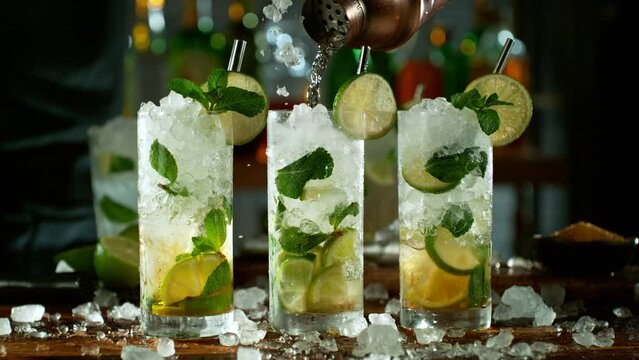 Super slow motion of making mojito cocktail with camera movement. Speed ramp effect. Filmed on high speed cinema camera with cinebot, 1000 fps.
