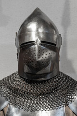 Medieval knight armor, closed iron helmet and torso armor, front view