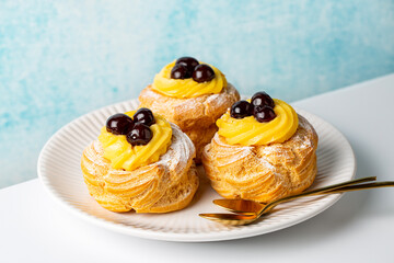 Italian pastry - zeppole di San Giuseppe, zeppola - baked puffs made from choux pastry, filled and...