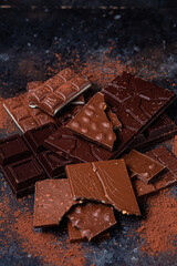 Chocolate bars on a dark background close-up