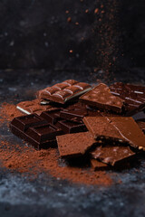 Chocolate bars on a dark background close-up