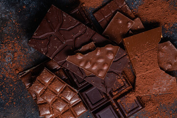 Chocolate bars on a dark background close-up