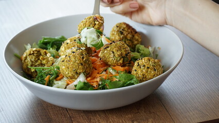 vegan salad bowl with pea balls
