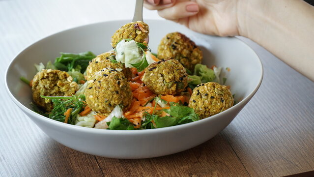 vegan salad bowl with pea balls - Powered by Adobe
