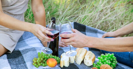 picnic in nature, girl pouring wine, couple in love. nature.