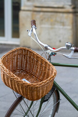 Close-up of an empty wicker basket on a bicycle handlebar
