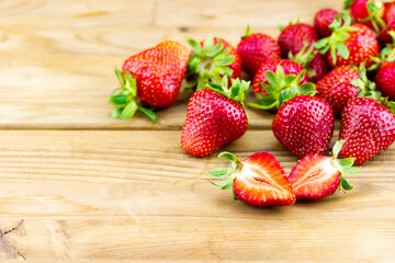 Close-up view of fresh strawberries on wooden background