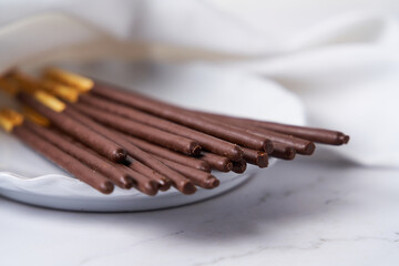 Set of Pocky on plate, popular japanese sweet.