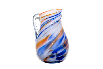 Multicolored glass jug on a white background