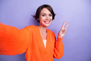 Photo of positive lovely lady wear trendy orange clothes demonstrate v-sign cool party empty space...