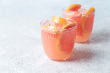 Refreshing low alcohol cocktail with grapefruit on a fresh stone background. Fruity light cocktails,  eco friendly  natural style, soft pastel colors