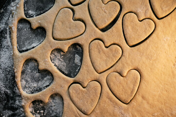 cooking heart shaped cookies in dough closeup