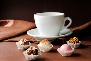 Chocolate truffles and a cup of coffe or tea