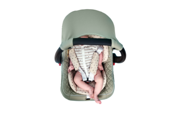 Baby in infant car seat on blue studio background, isolated on a white background. Carrier for transporting newborn babies in a chair. Kid aged two months