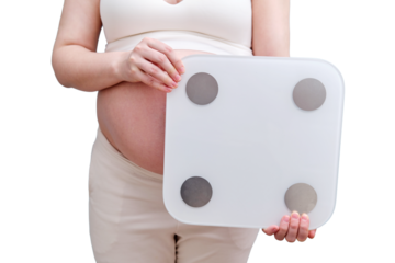 A pregnant woman holds a weighing scale in her hands, isolated on a white background