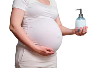 Liquid soap with dispenser in hands of pregnant woman, studio shot isolated on a white background