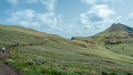 Ponta de Sao Lourenco peninsula in east coast of Madeira, Portugal during sunny winter day in Atlantic ocean with Casa do Sardinha, Miraduro Ponta do Furado and tourist footpath in the back, Europe