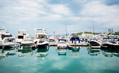 Yacht parking in harbor, harbor yacht club. Beautiful Yachts in blue sky background. Luxury super...