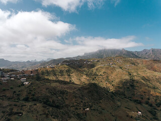 Aerial photos of Assomada in Santiago Island, Cabo Verde, reveal the vibrant culture, colorful markets, and stunning mountain landscapes of this historic town. The bird's-eye view captures the essence